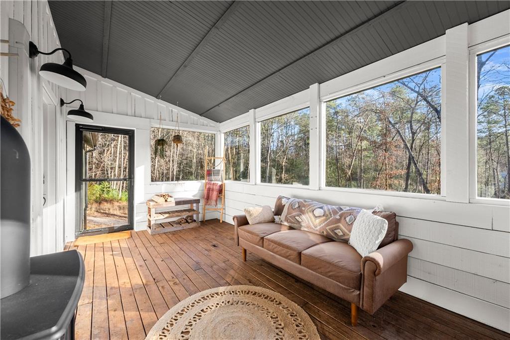 121 Waterfalls Way Clarkesville, GA 30523 - Photo 38 of 60 a living room with furniture and a large window