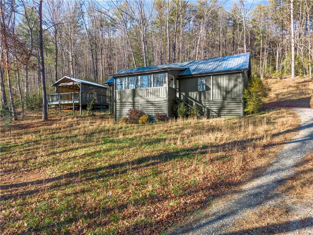 121 Waterfalls Way Clarkesville, GA 30523 - Photo 4 of 60 a view of a house with a yard