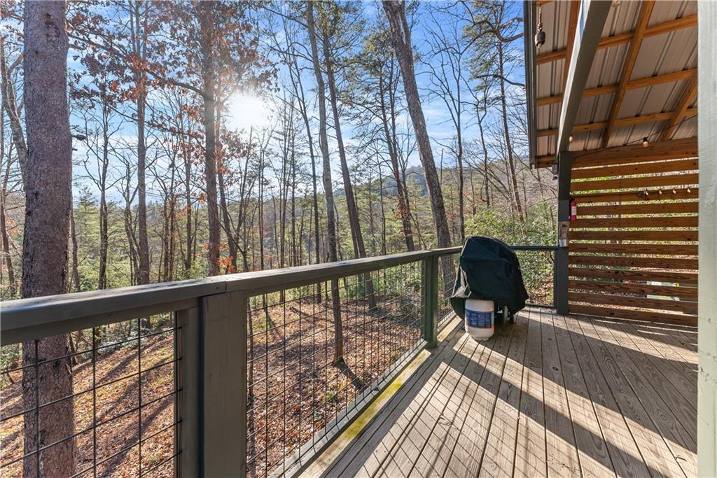 121 Waterfalls Way Clarkesville, GA 30523 - Photo 47 of 60 a view of balcony with wooden floor and outdoor seating