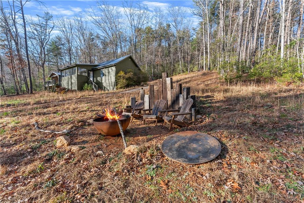 121 Waterfalls Way Clarkesville, GA 30523 - Photo 50 of 60 a view of a backyard with sitting area