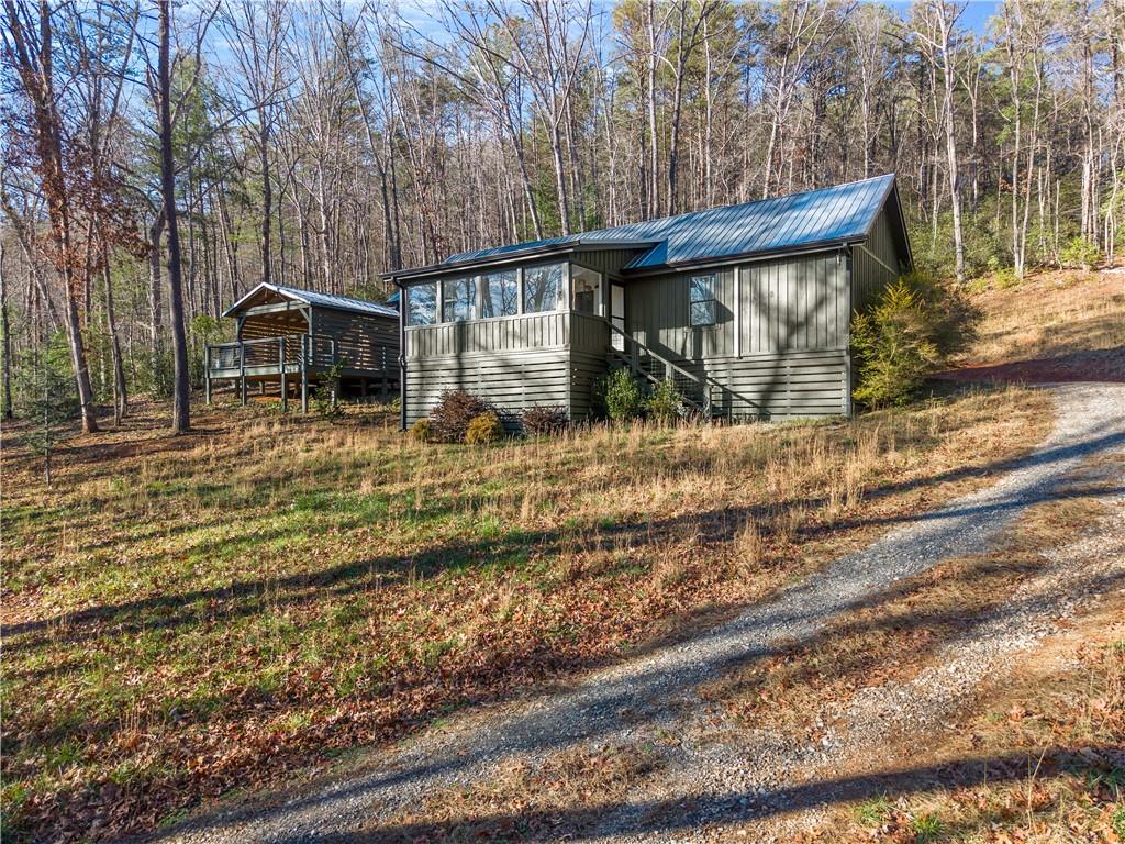 121 Waterfalls Way Clarkesville, GA 30523 - Photo 5 of 60 a view of a house with a yard
