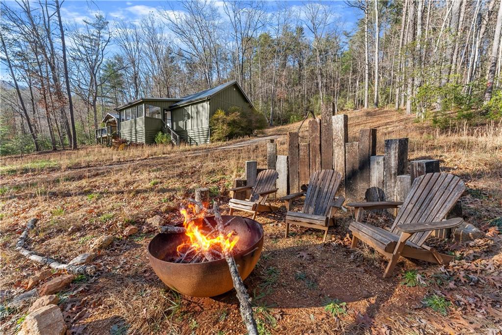 121 Waterfalls Way Clarkesville, GA 30523 - Photo 51 of 60 a view of an chairs and tables in the patio