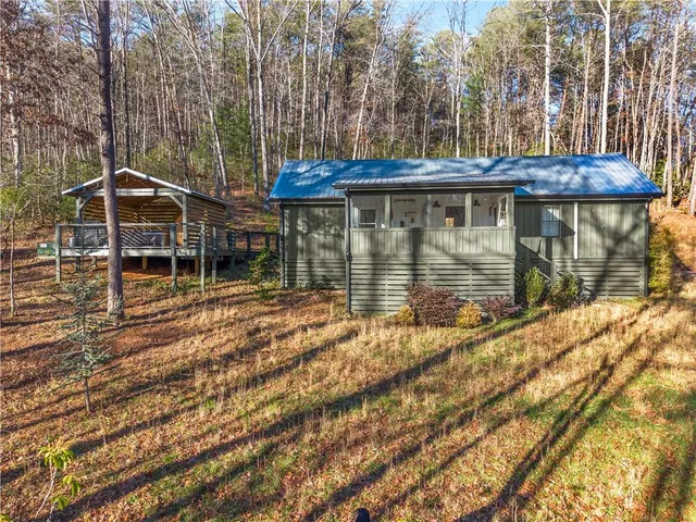 a view of house with a small yard