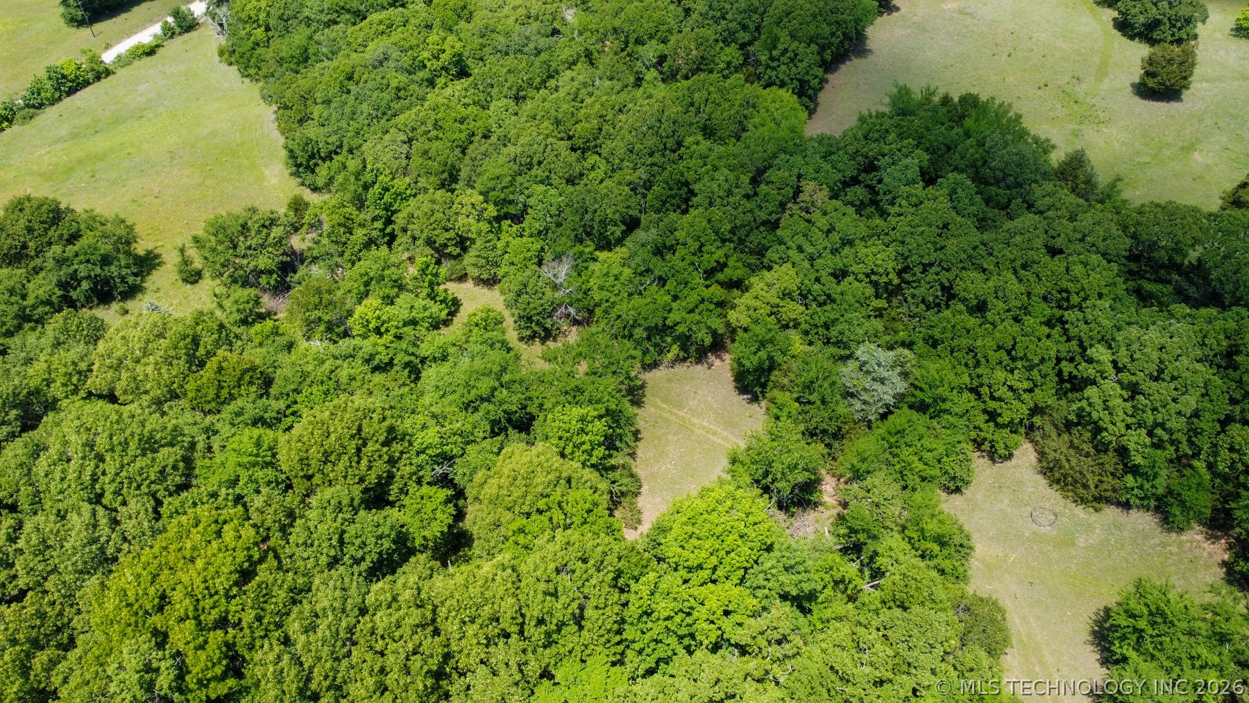 13248 North 3540th Road Maud, OK 74854 - Photo 36 of 98 Expansive aerial landscape featuring a mixture of dense woodlands and open grassy areas