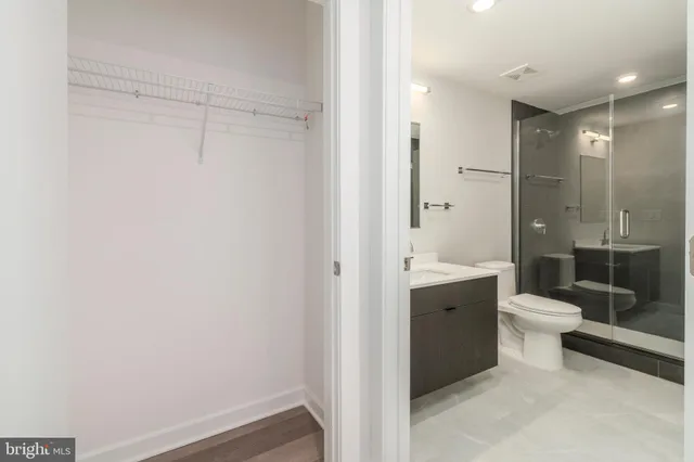 a bathroom with a toilet a sink and shower