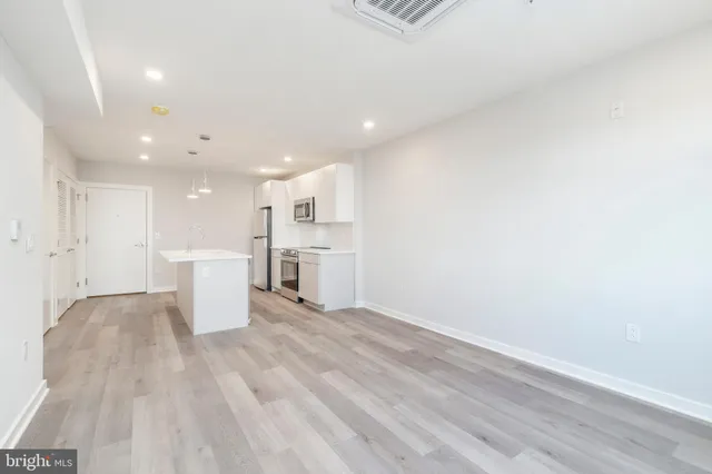 a view of kitchen with wooden floor