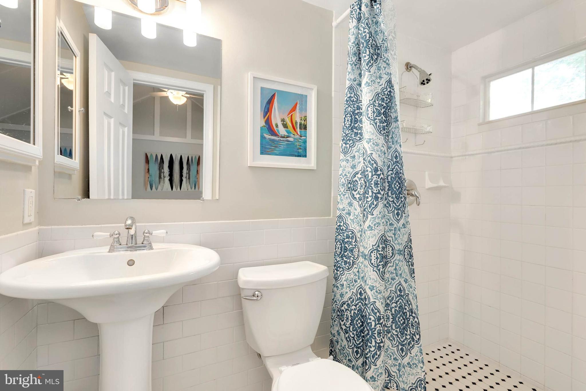 4 High Street Round Hill, VA 20141 - Photo 13 of 51 a bathroom with a sink toilet and shower