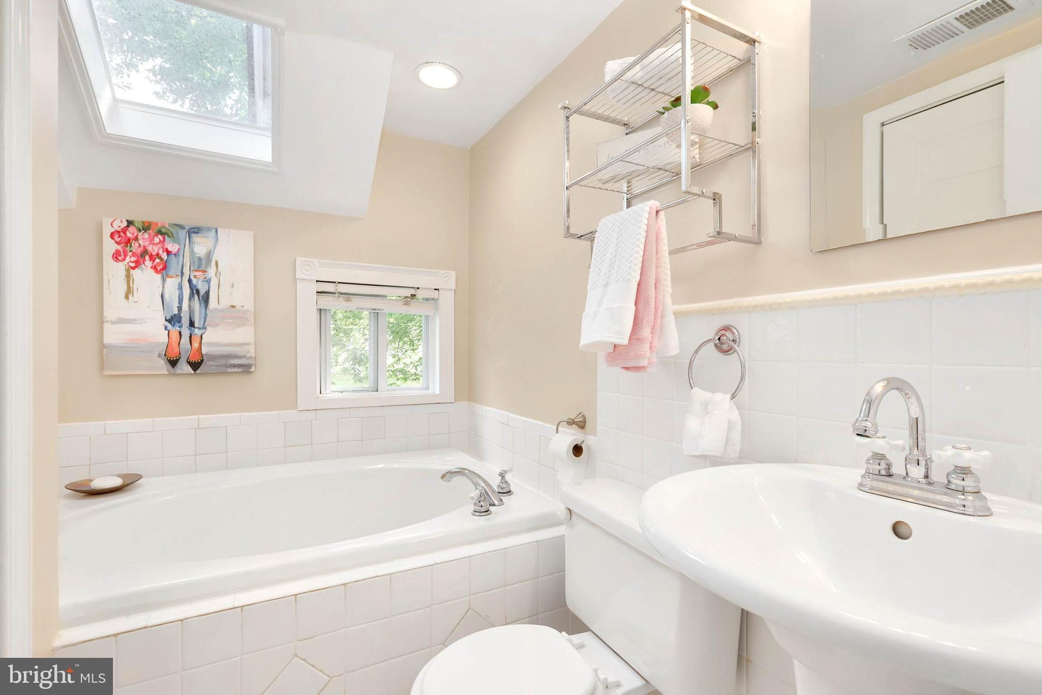 4 High Street Round Hill, VA 20141 - Photo 14 of 51 a bathroom with a sink a bathtub and a window