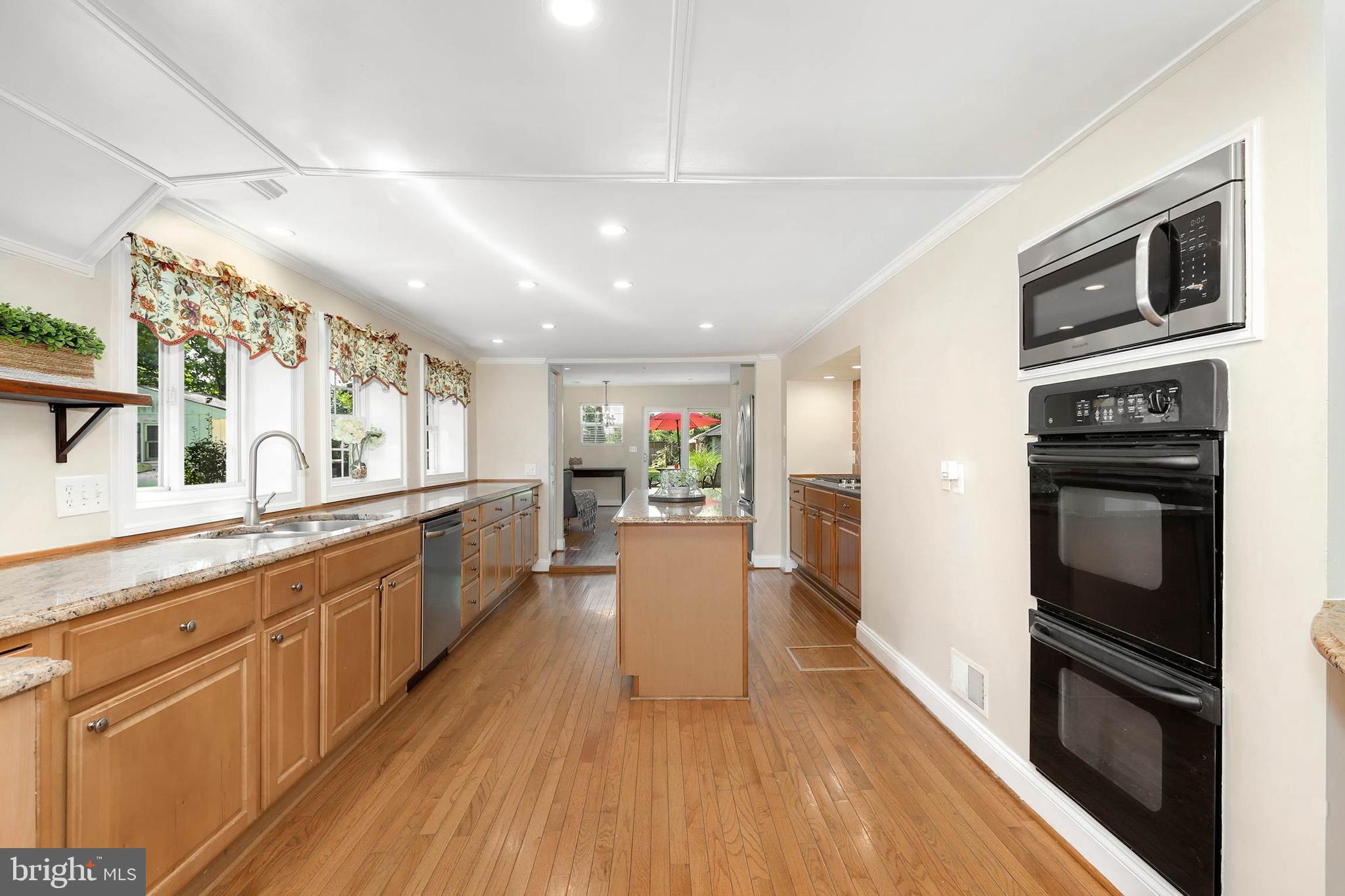 4 High Street Round Hill, VA 20141 - Photo 21 of 51 a large kitchen with cabinets wooden floor and stainless steel appliances