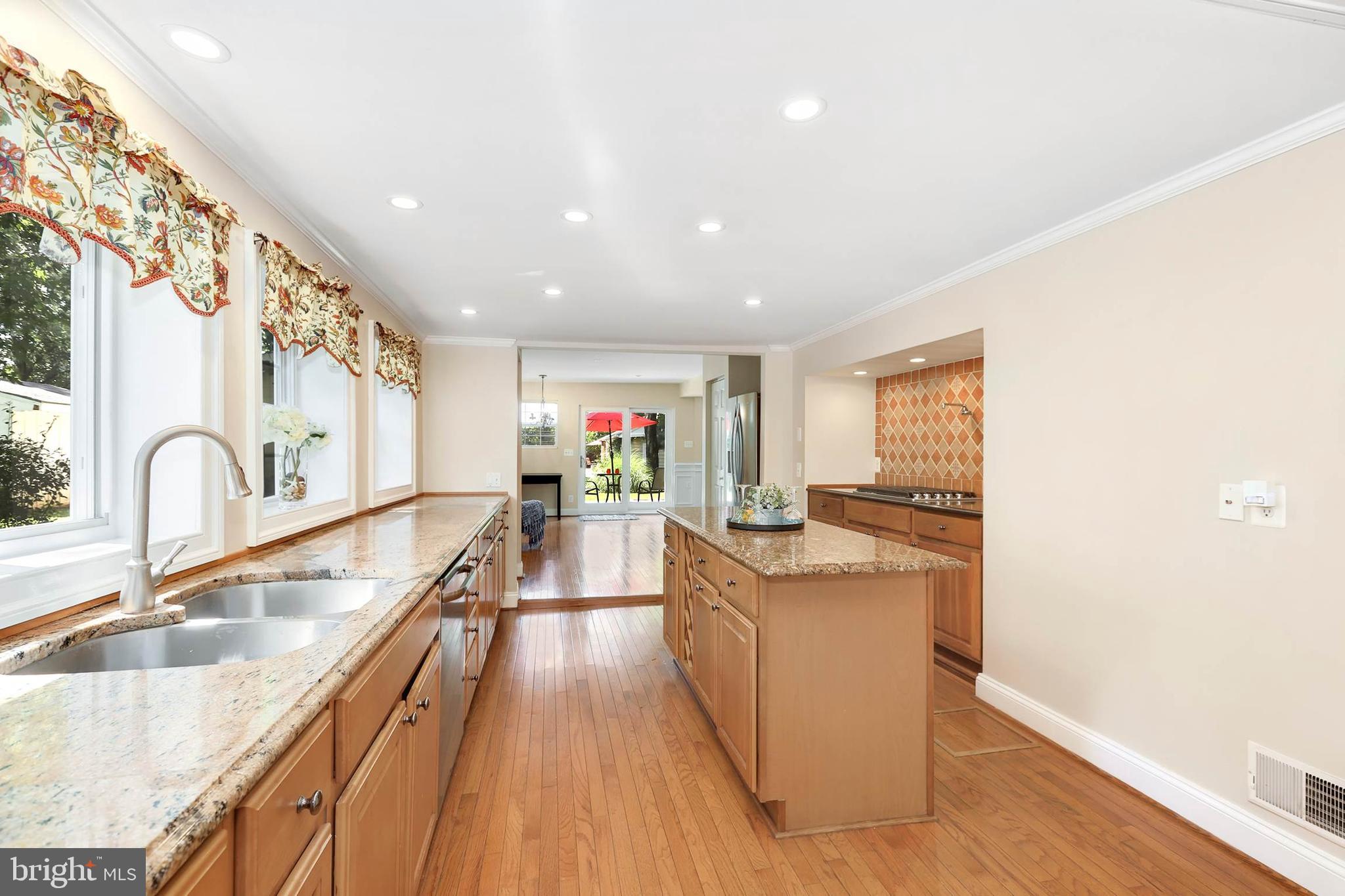 4 High Street Round Hill, VA 20141 - Photo 24 of 51 a kitchen with stainless steel appliances granite countertop a sink stove and wooden floor