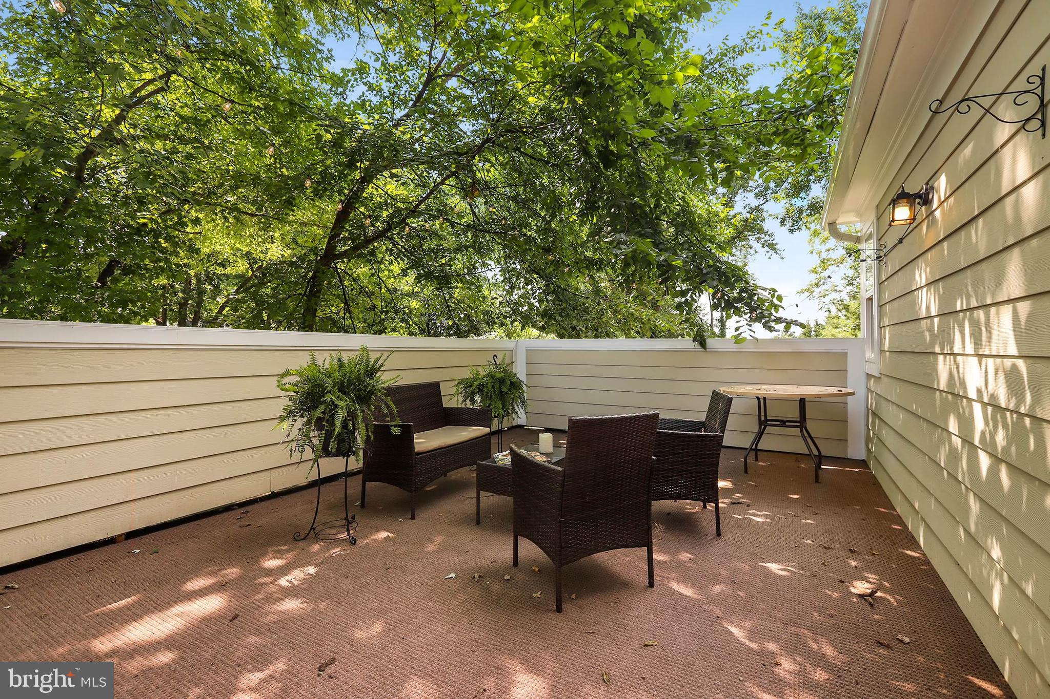 4 High Street Round Hill, VA 20141 - Photo 38 of 51 a view of a patio with table and chairs and wooden fence