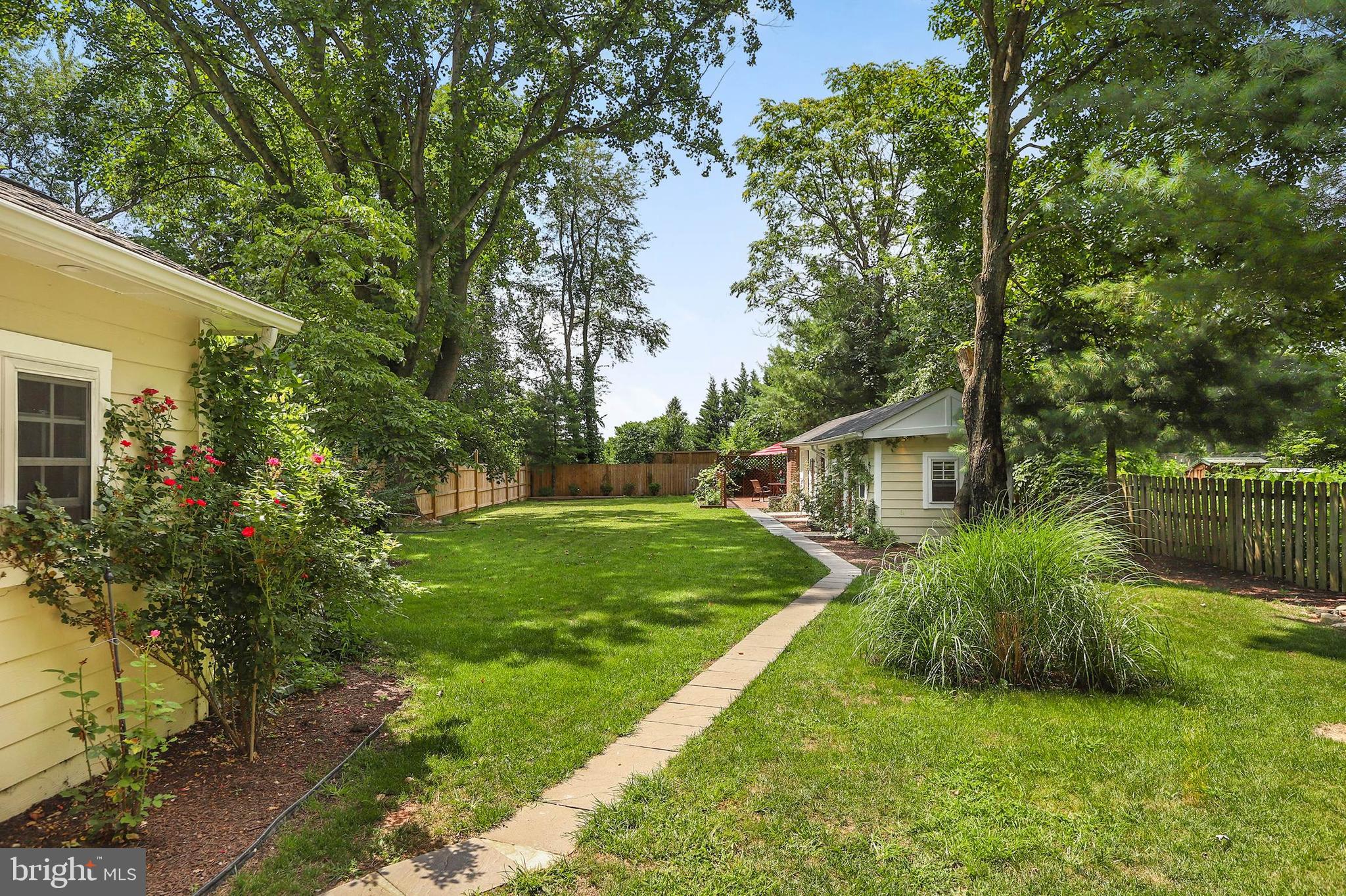 4 High Street Round Hill, VA 20141 - Photo 49 of 51 a backyard of a house with plants and large tree