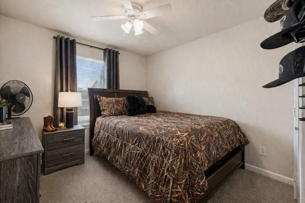 a bedroom with a bed and window