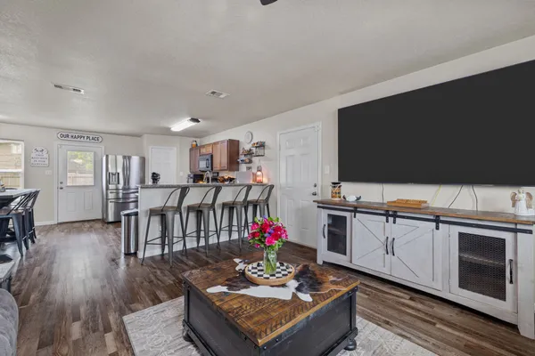 a living room with furniture and a flat screen tv