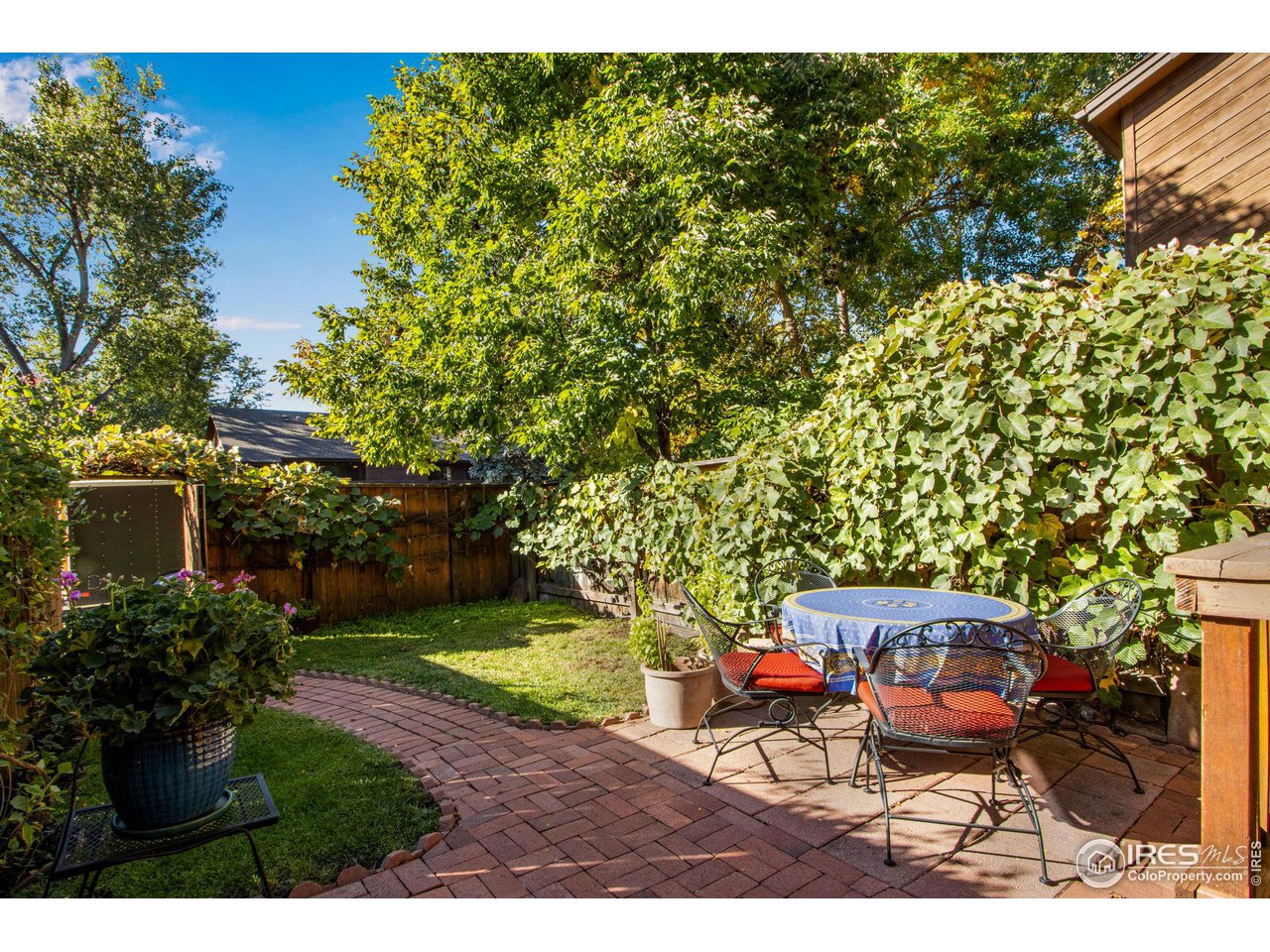 2659 Juniper Avenue, Unit 30 Boulder, CO 80304 - Photo 27 of 35 a backyard of a house with yard and outdoor seating