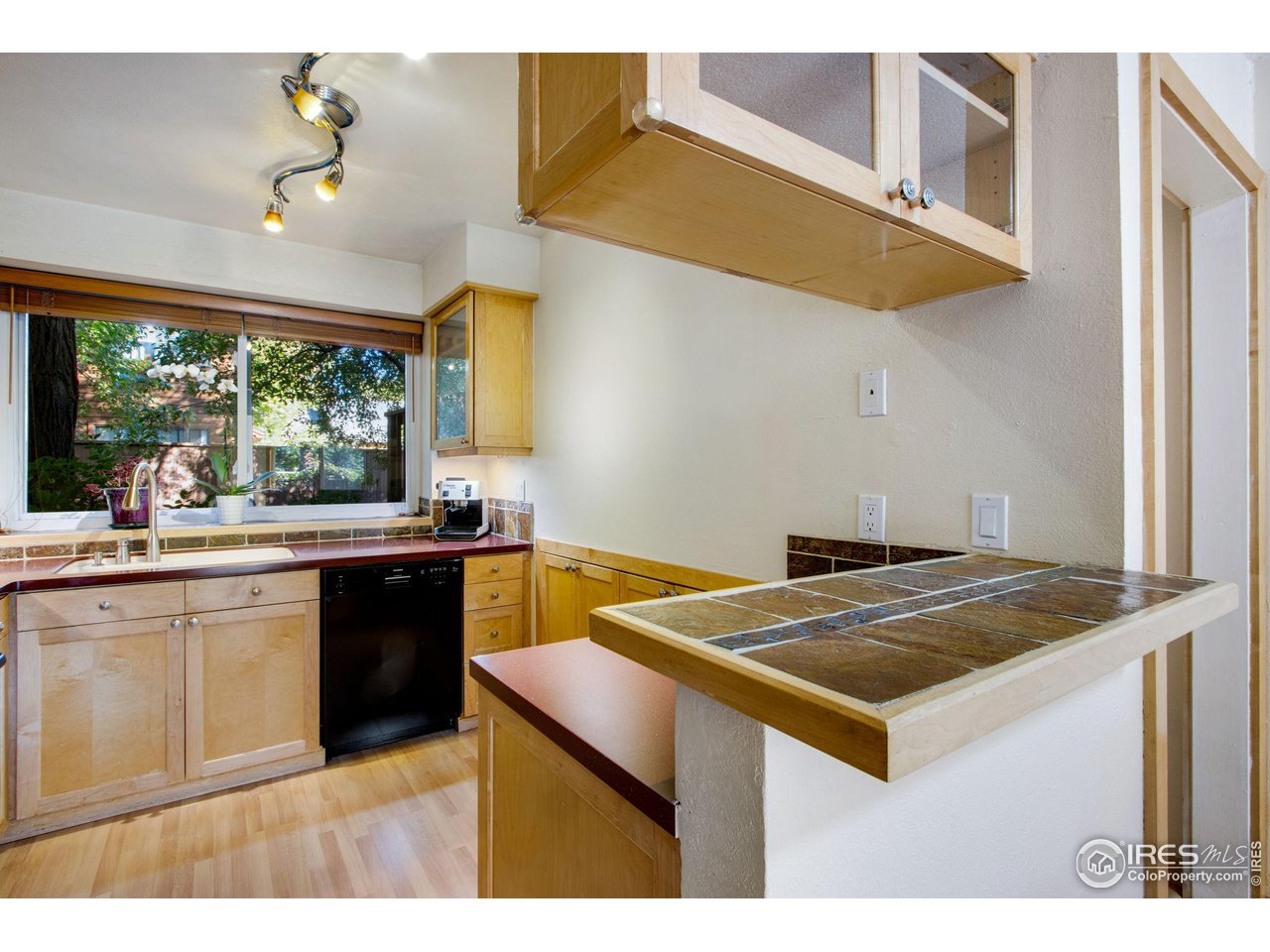 2659 Juniper Avenue, Unit 30 Boulder, CO 80304 - Photo 6 of 35 a kitchen that has a sink and a stove