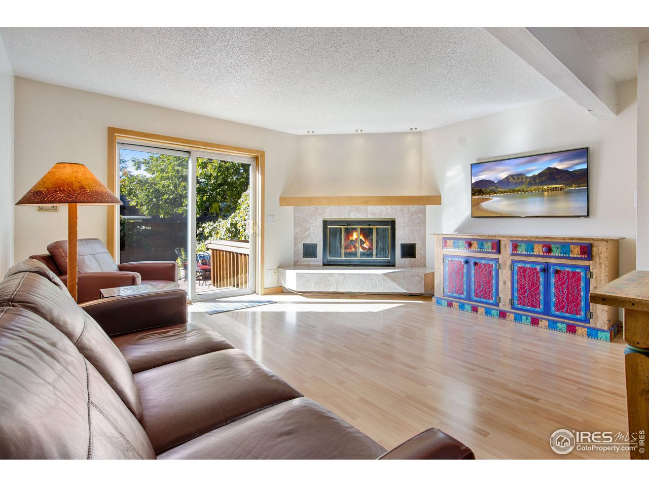 2659 Juniper Avenue, Unit 30 Boulder, CO 80304 - Photo 9 of 35 a living room with furniture and a fireplace