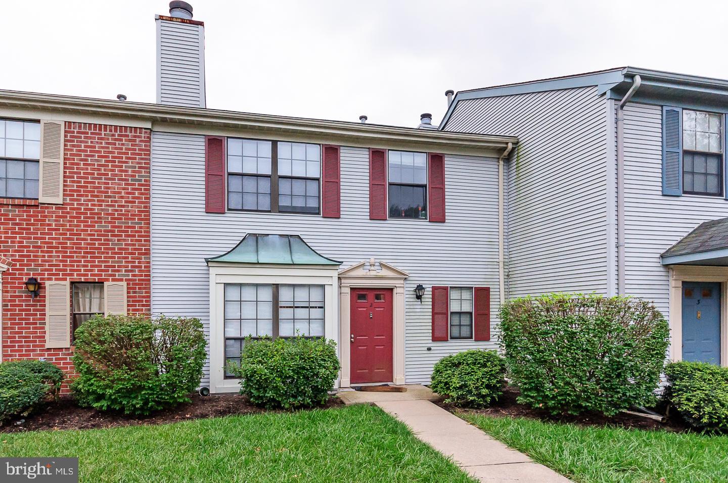 2 Stout Court Lawrence Township, NJ 08648 - Photo 1 of 13 a front view of a house with garden
