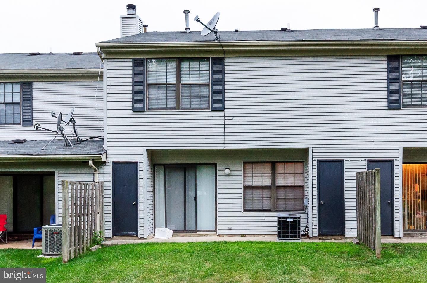 2 Stout Court Lawrence Township, NJ 08648 - Photo 11 of 13 a view of a house with many windows and a yard