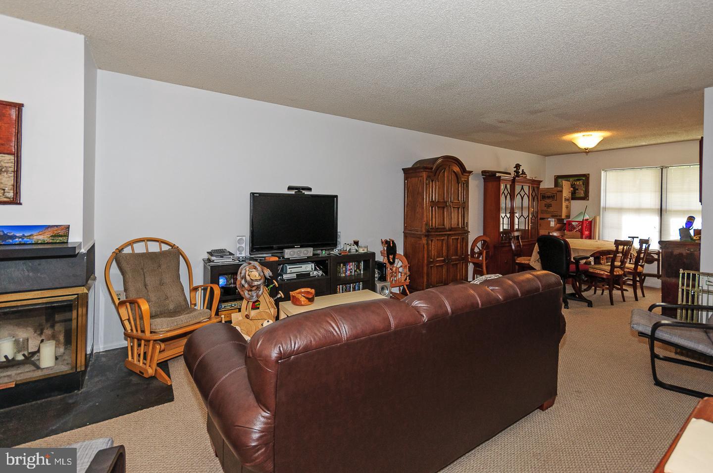 2 Stout Court Lawrence Township, NJ 08648 - Photo 4 of 13 a living room with furniture and a flat screen tv