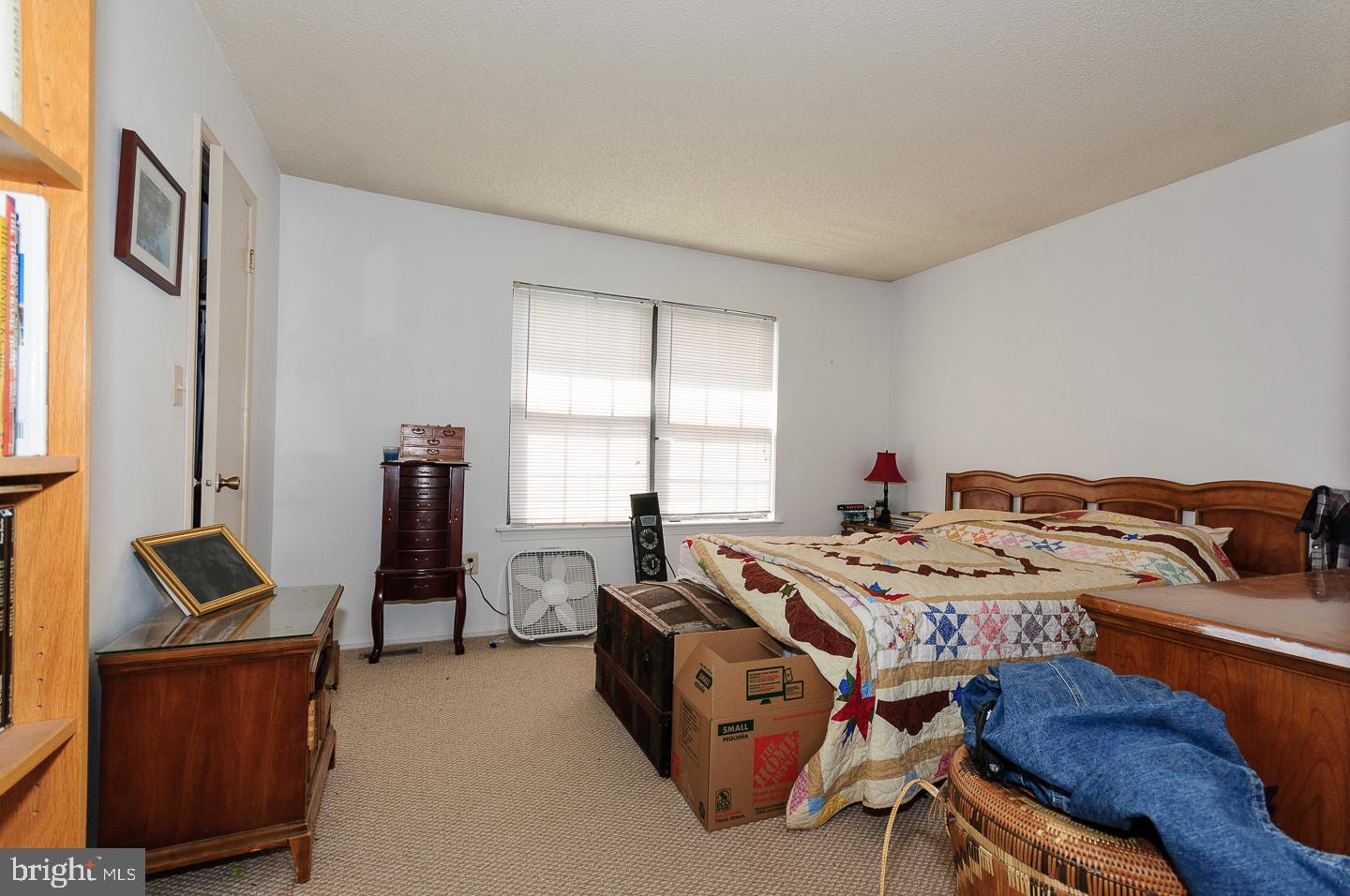 2 Stout Court Lawrence Township, NJ 08648 - Photo 10 of 13 a bed sitting in a room next to a window