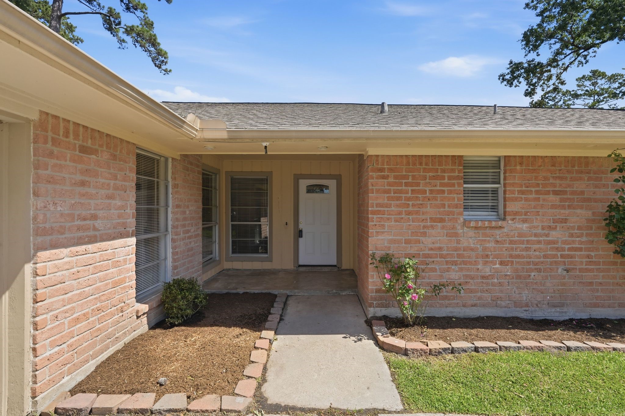 25611 Timberlane Drive Spring, TX 77386 - Photo 5 of 38 a view of a patio with a table and chairs and potted plants