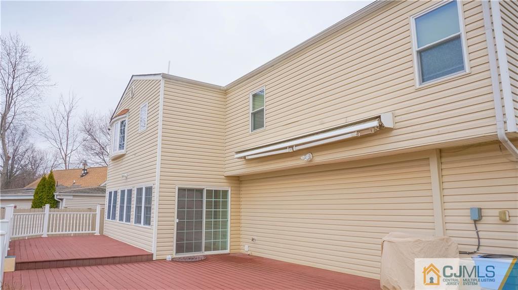 8 Outcalt Road Edison, NJ 08817 - Photo 14 of 21 a view of a house with a small deck
