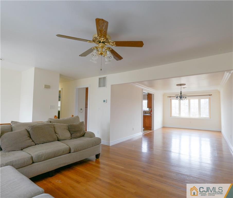 8 Outcalt Road Edison, NJ 08817 - Photo 3 of 21 a living room with furniture and a wooden floor