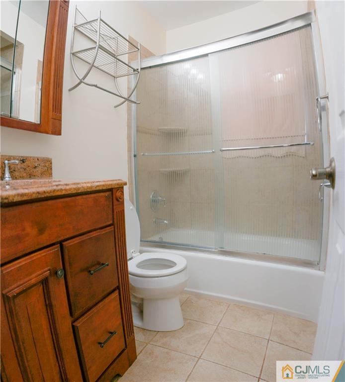 8 Outcalt Road Edison, NJ 08817 - Photo 8 of 21 a bathroom with a granite countertop sink toilet and shower