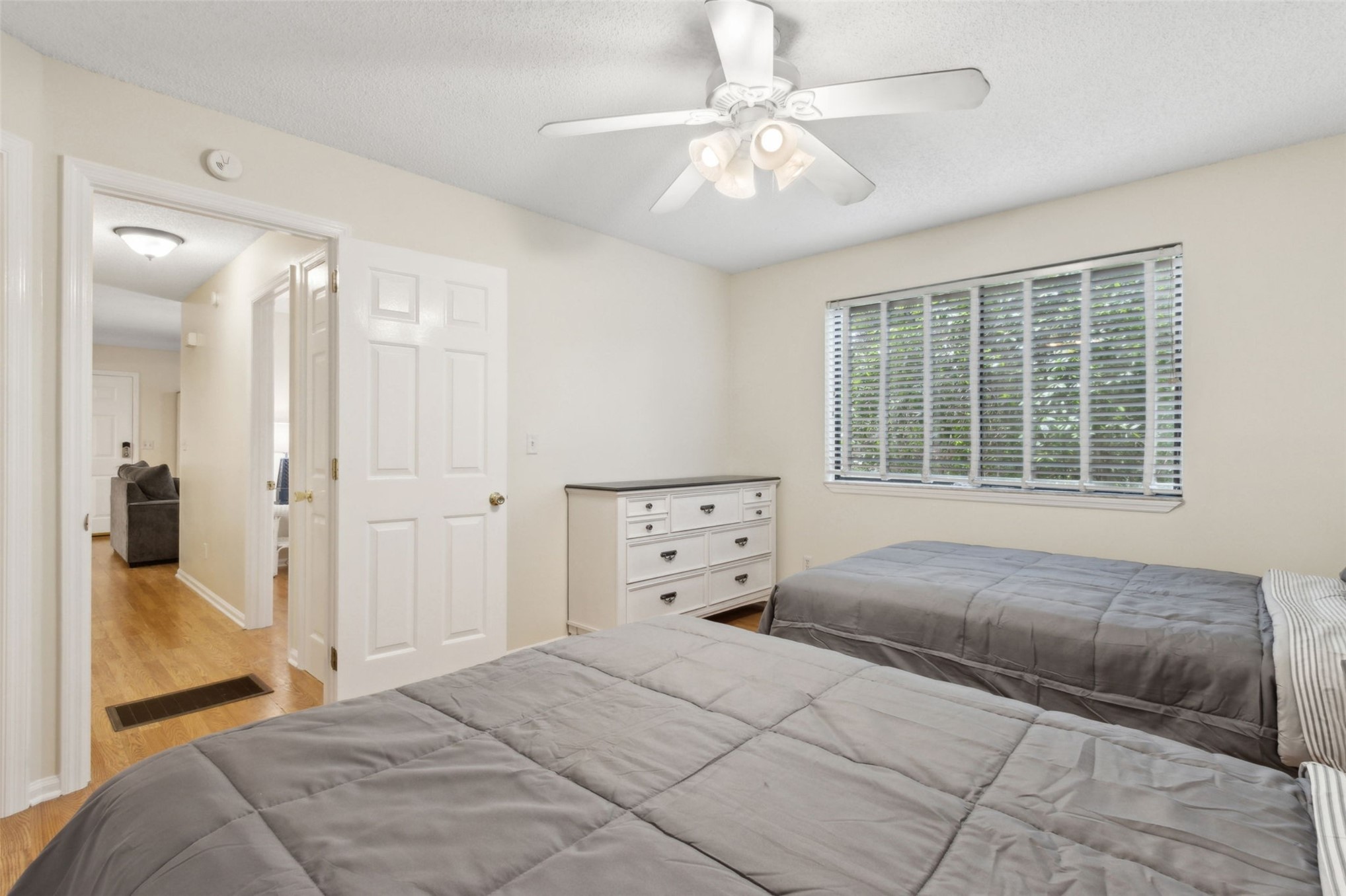 2583 Forest Ridge Drive, Unit N3 Fernandina Beach, FL 32034 - Photo 20 of 34 a spacious bedroom with a large bed and a chandelier