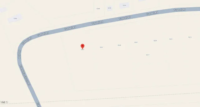 a view of a room with dryer and white walls