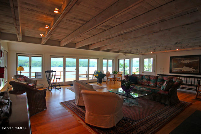 17 Mahkeenac Road Stockbridge, MA 01262 - Photo 14 of 46 a living room with furniture fireplace and large windows