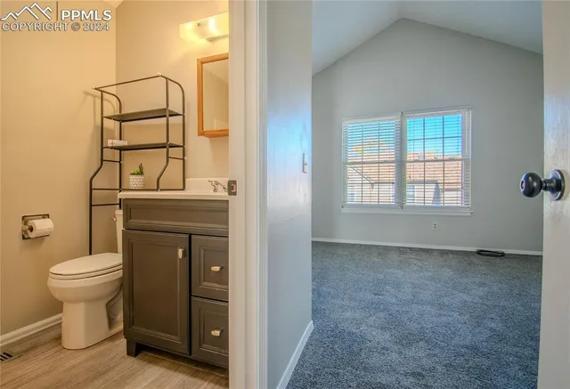 a bathroom with a toilet and a sink