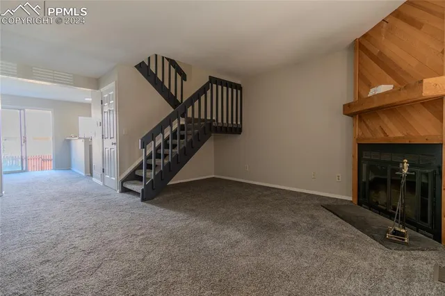a view of a livingroom with staircase