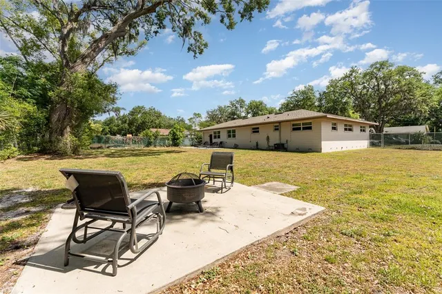 a view of a swimming pool with lounge chair