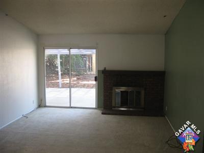 44025 Glenraven Road Lancaster, CA 93535 - Photo 2 of 5 a living room with a fireplace