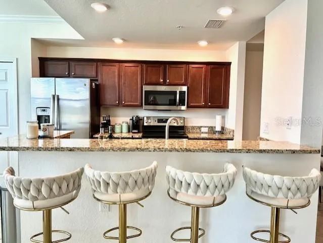 a kitchen with a dining table and chairs