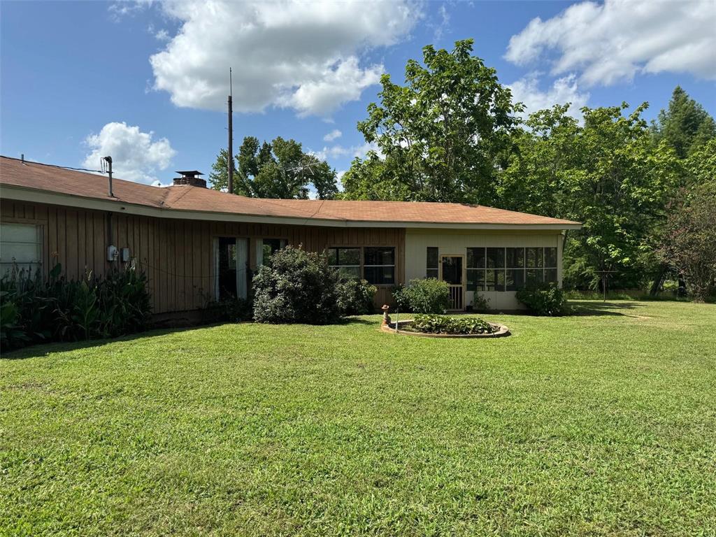 1111 Gilmer Road Winnsboro, TX 75494 - Photo 7 of 11 a front view of a house with garden