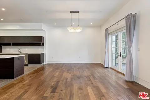 a view of a kitchen with a sink cabinet and a fireplace