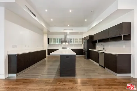 a kitchen with a sink and an oven