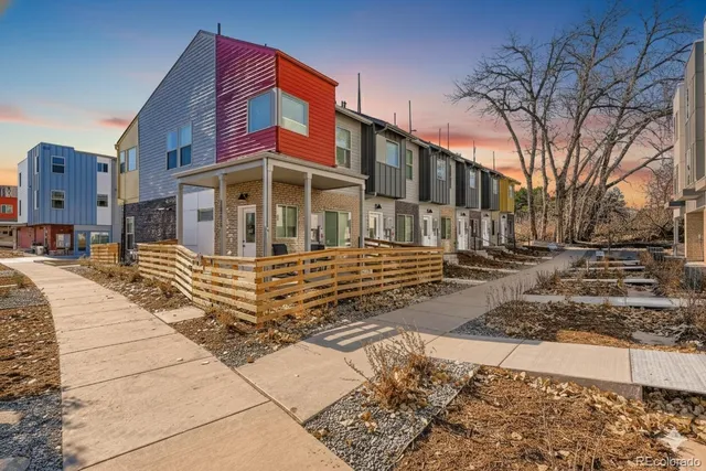 an aerial view of a house with swimming pool garden and patio