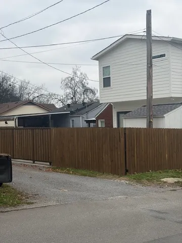 a front view of a house with a fence
