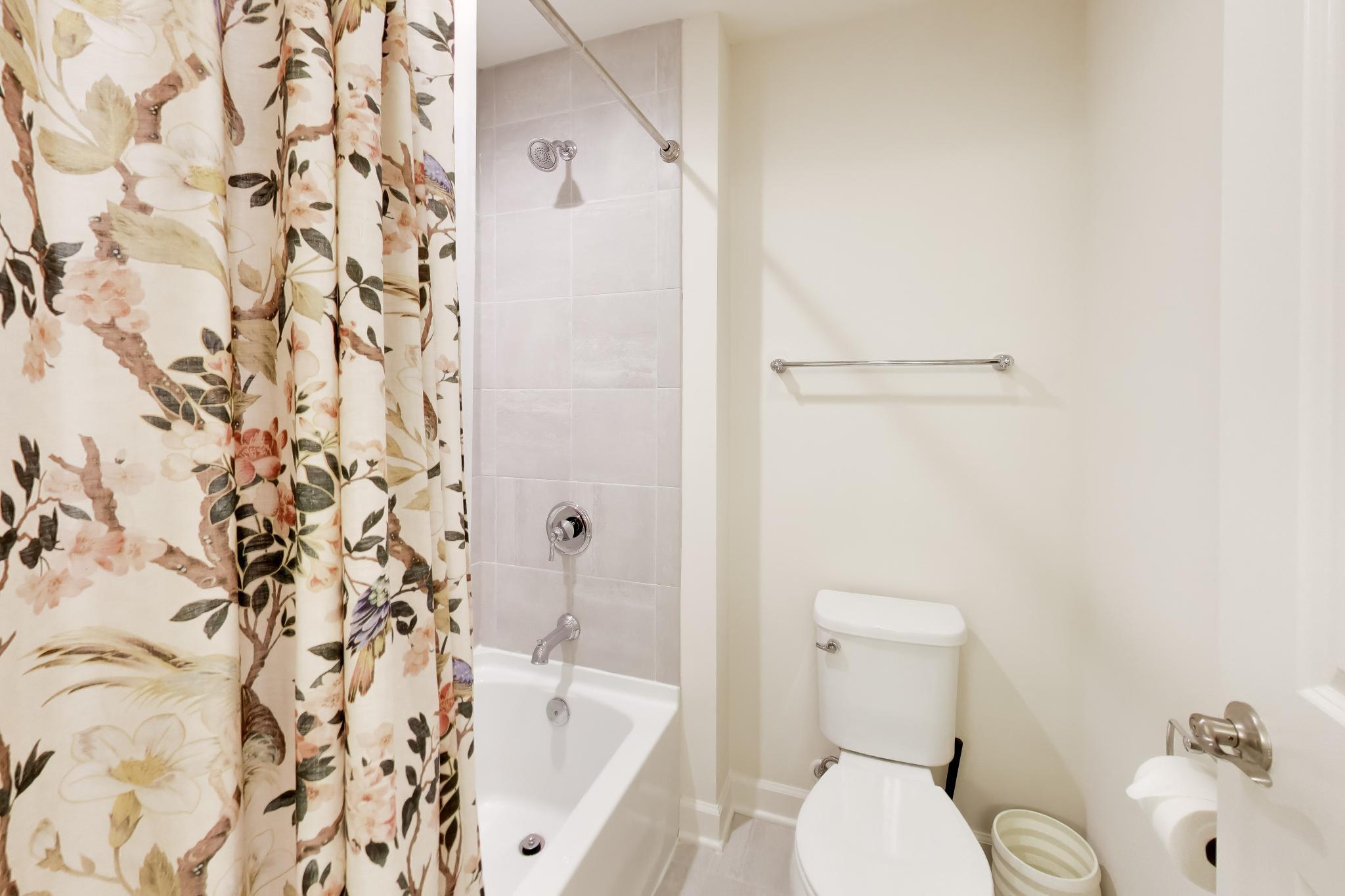 2730 Harbor Court Delavan, WI 53115 - Photo 33 of 47 Upper-level bath with tub/shower combination, tile surround, and separate vanity area.