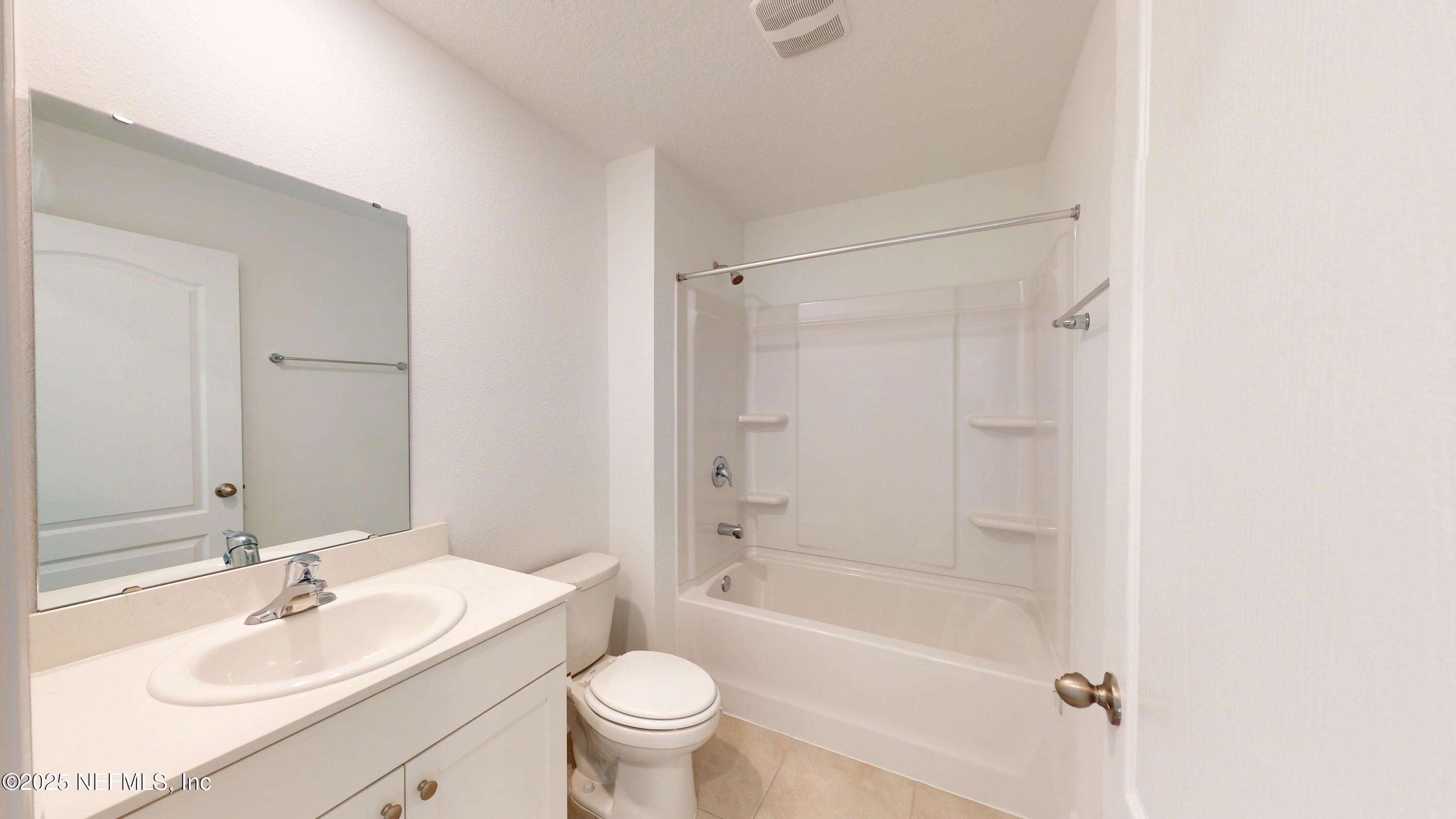 169 Seaport Breeze Road St. Augustine, FL 32095 - Photo 11 of 21 a bathroom with a sink toilet and shower