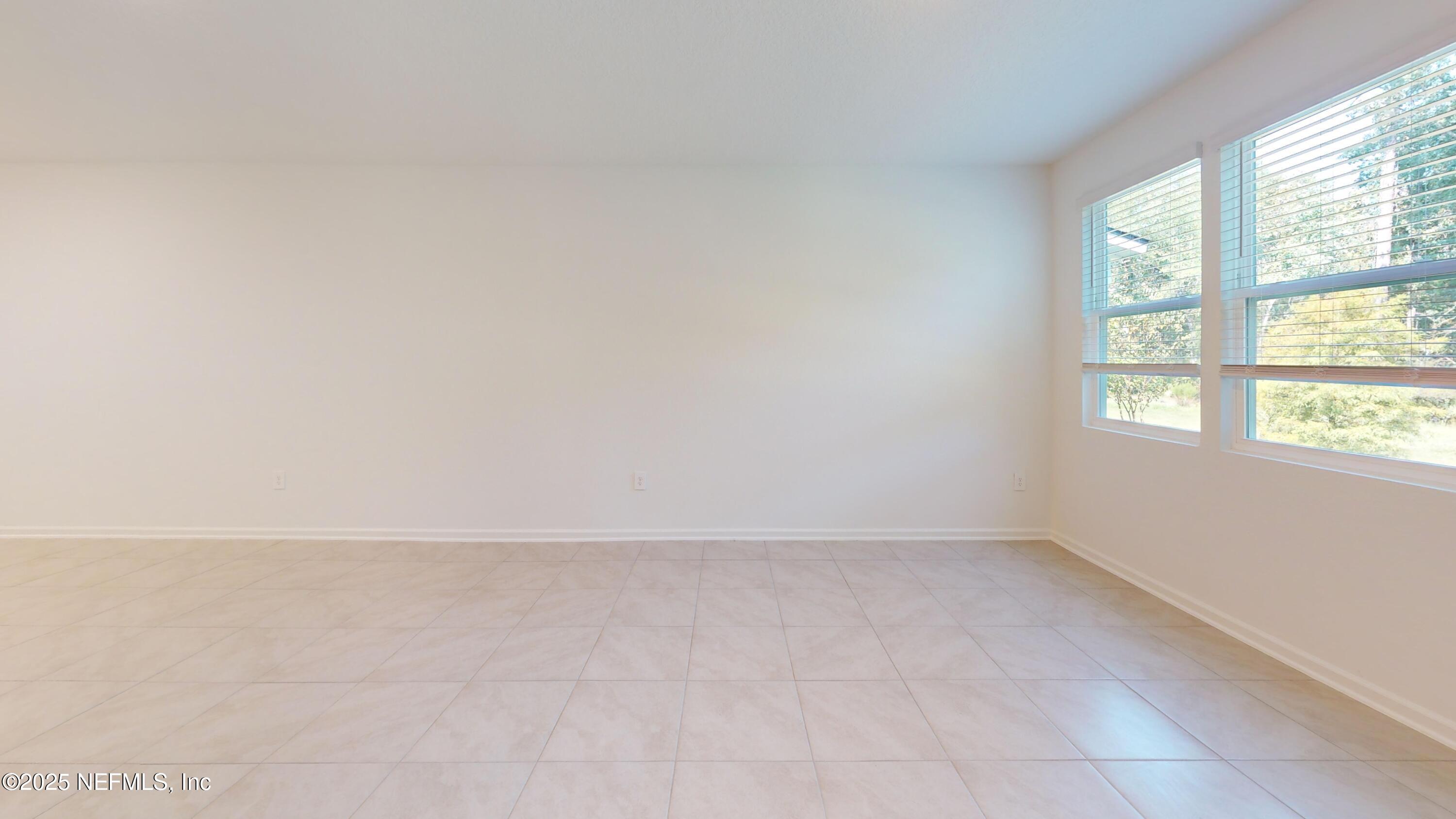 169 Seaport Breeze Road St. Augustine, FL 32095 - Photo 17 of 21 an empty room with a window