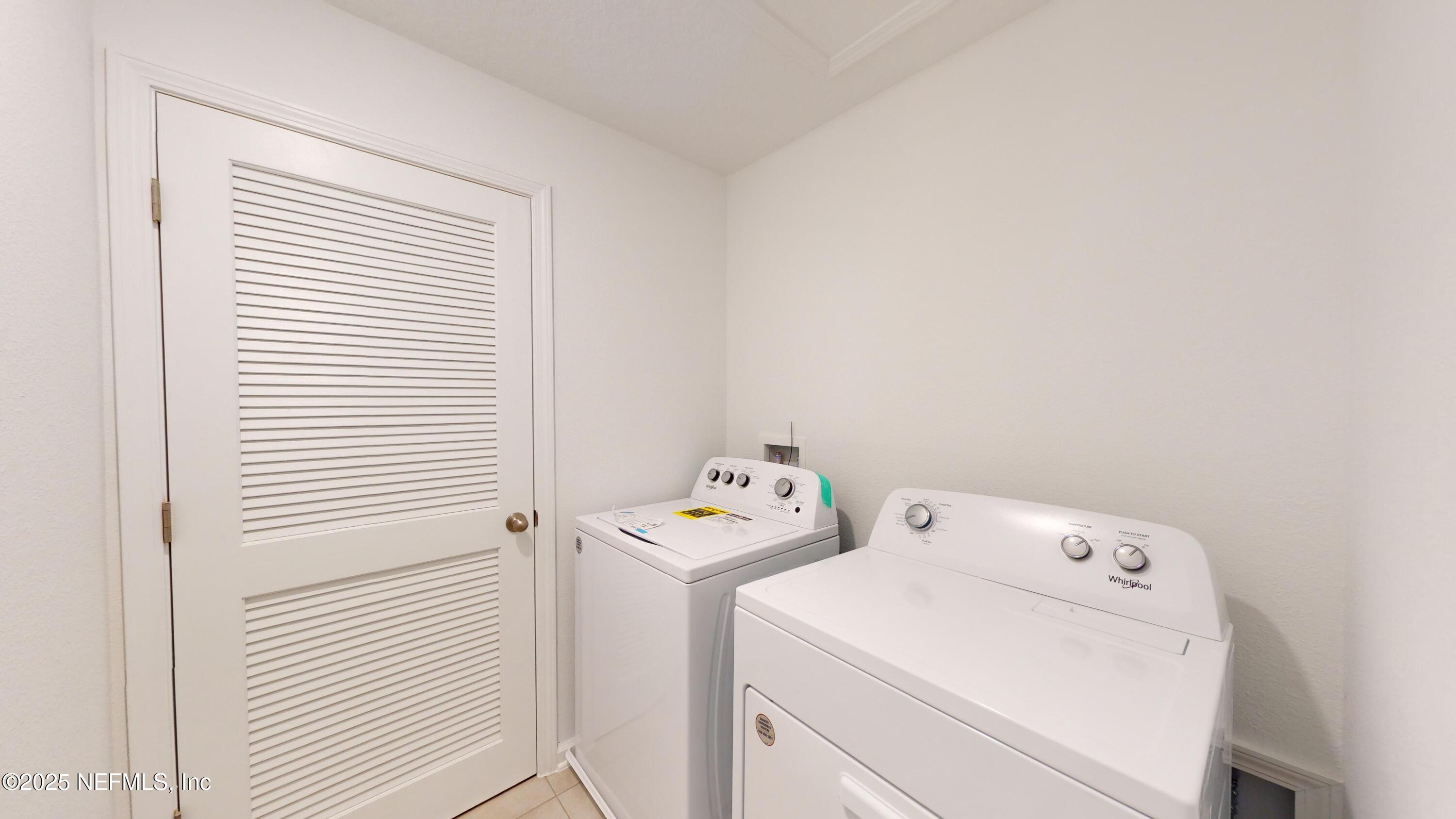 169 Seaport Breeze Road St. Augustine, FL 32095 - Photo 18 of 21 a utility room with dryer and washer