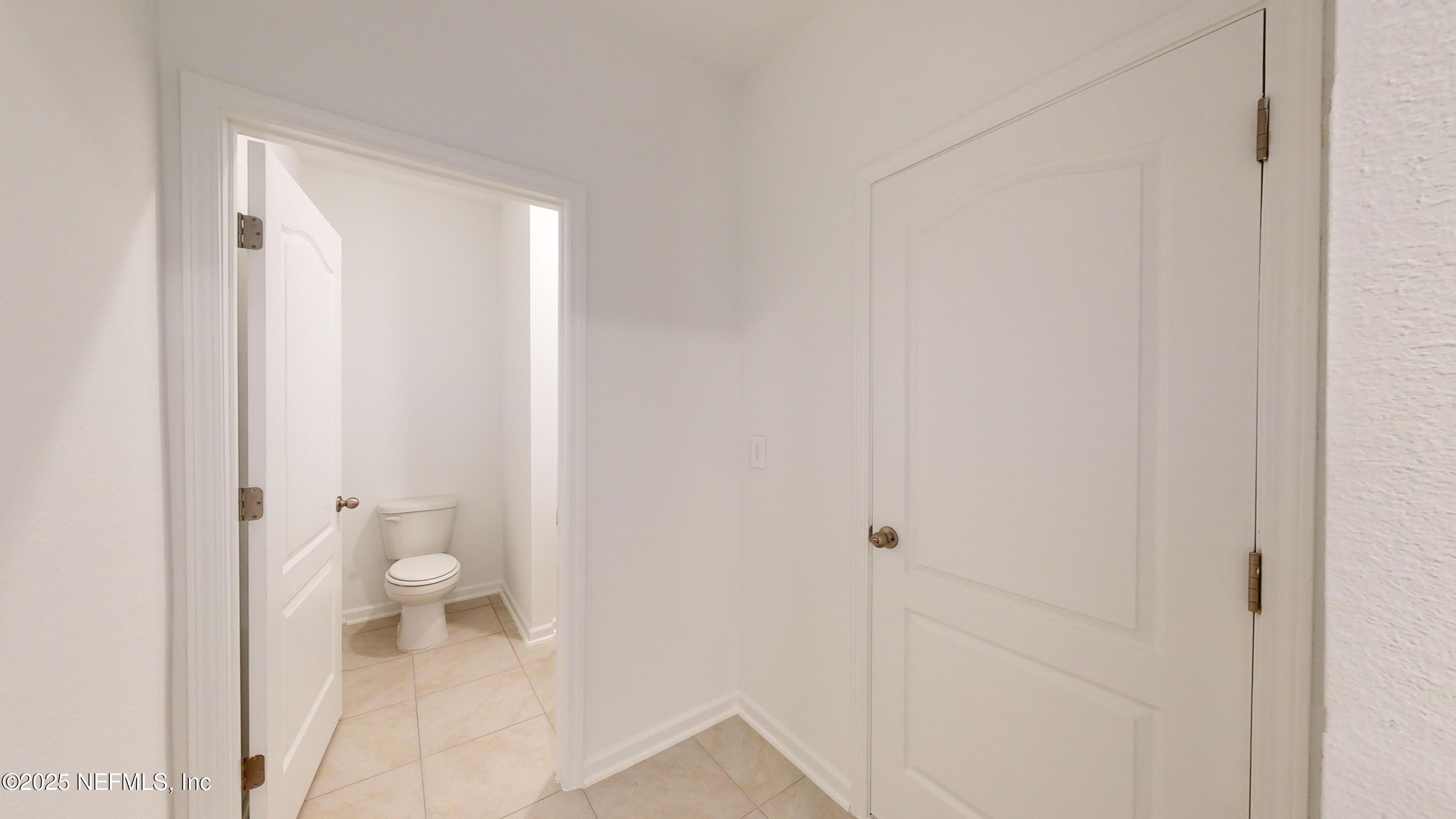 169 Seaport Breeze Road St. Augustine, FL 32095 - Photo 9 of 21 a bathroom with a toilet