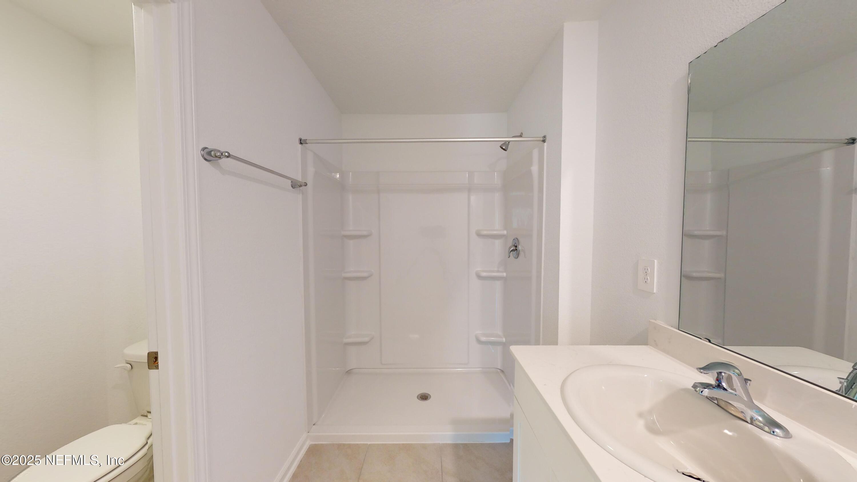 169 Seaport Breeze Road St. Augustine, FL 32095 - Photo 10 of 21 a bathroom with a sink toilet and shower