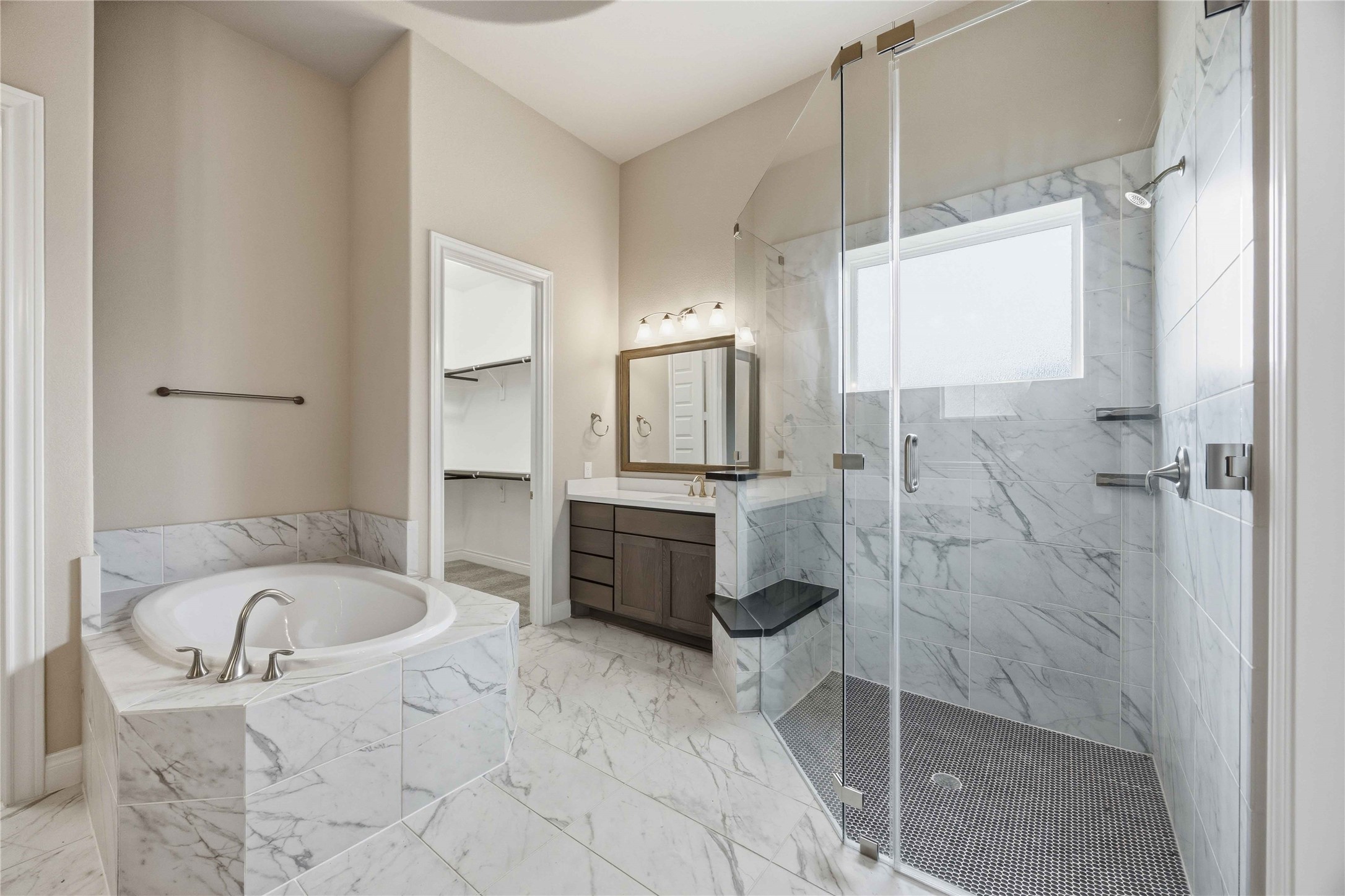 17564 Watercolor Way Conroe, TX 77302 - Photo 25 of 42 En Suite luxury primary bath has dual vanities, soaking sub, separate shower and two closets