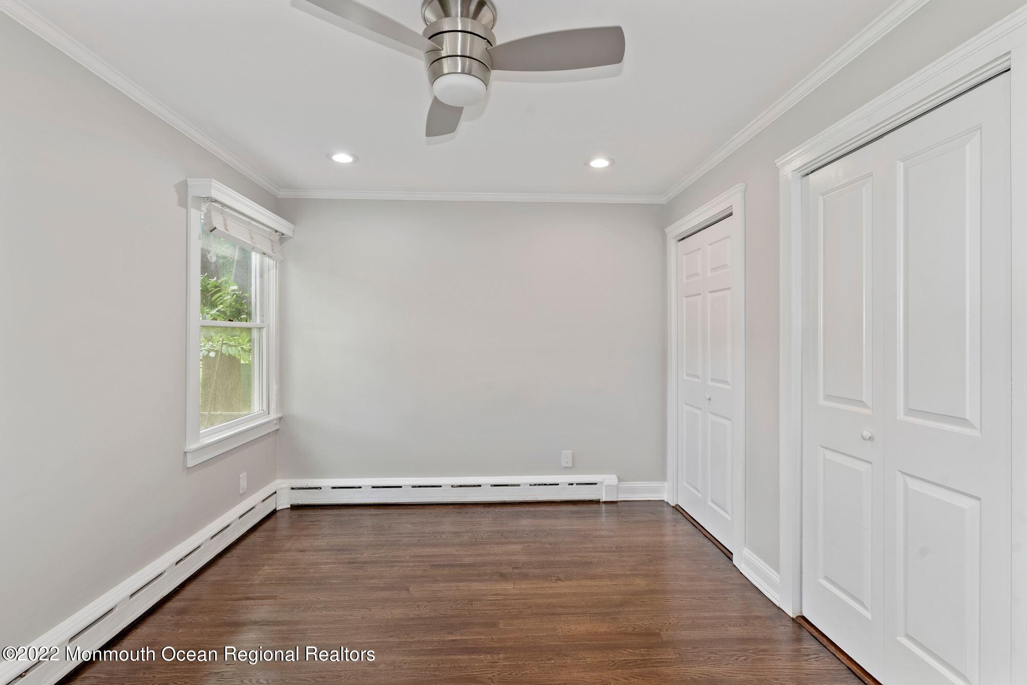 738 Holmdel Road Holmdel, NJ 07733 - Photo 11 of 36 wooden floor in an empty room with a window